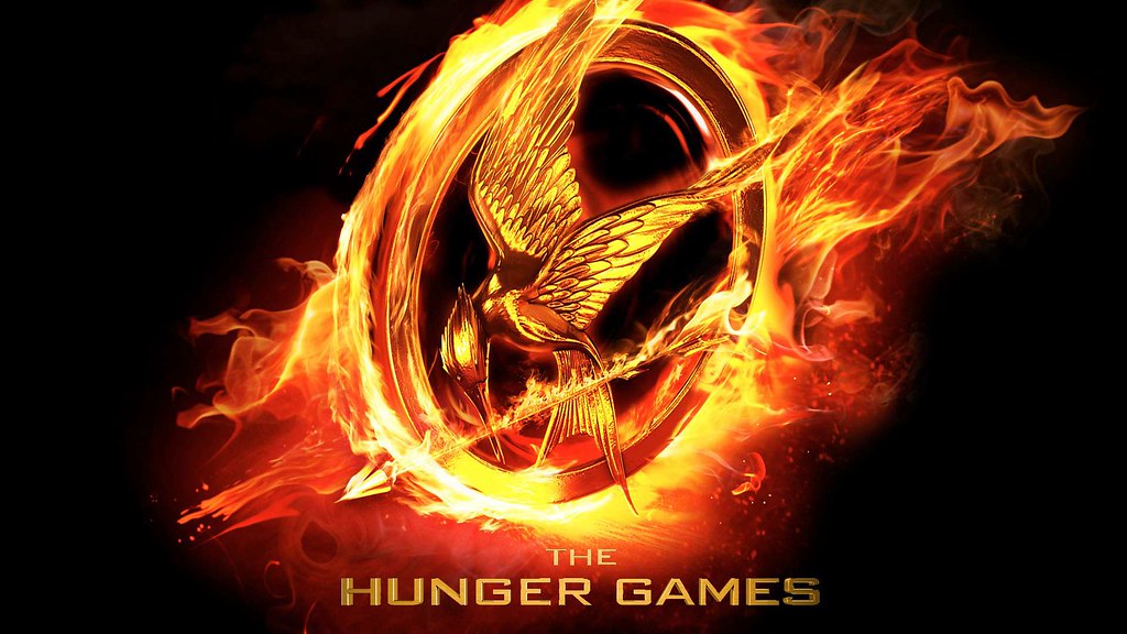 The+iconic+Hunger+Games+logo+on+fire%21
