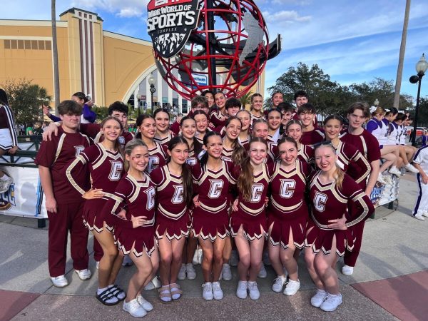 The Cheer team in front of the ESPN ball on comp day.