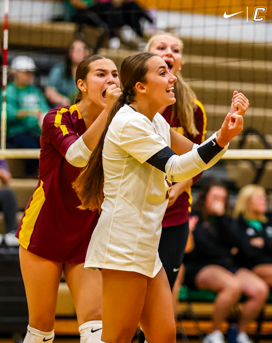 Senior Cassandra Lange sparks excitement to the team after a successful volley.