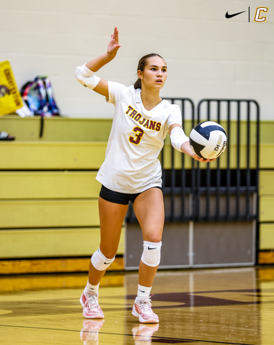 Junior Ryleigh Connor prepares to serve the ball.