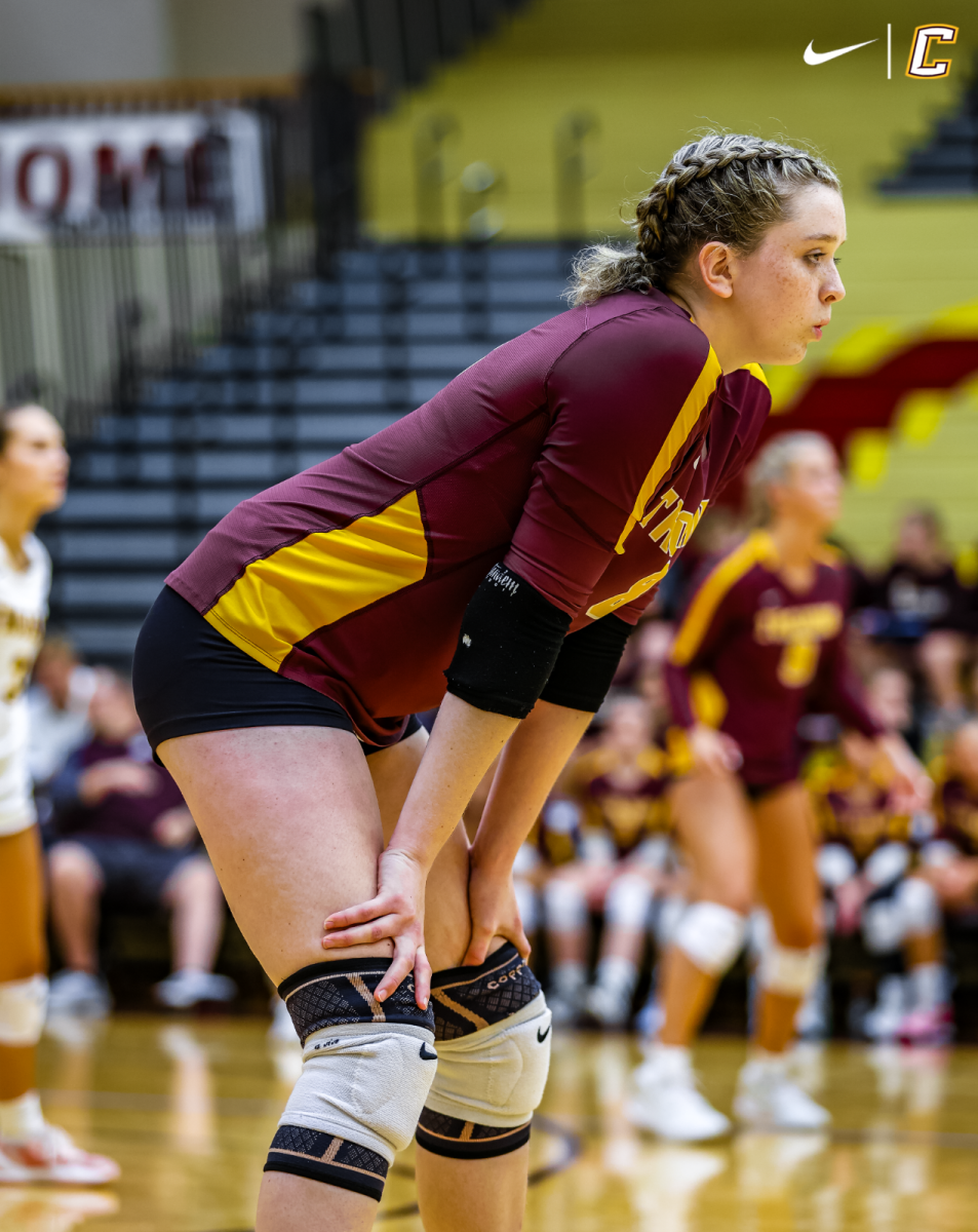 Senior Marissa Roe calms any nerves she may have before the next volley.