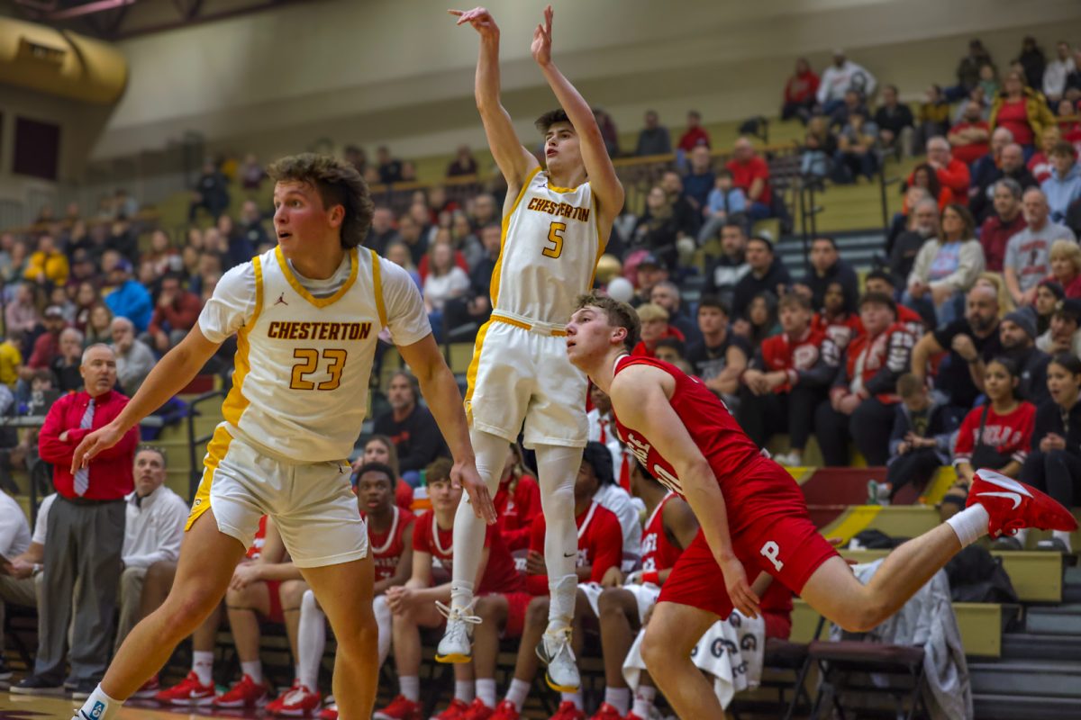 Junior Logan Pokorney drains a three right before the first half buzzer